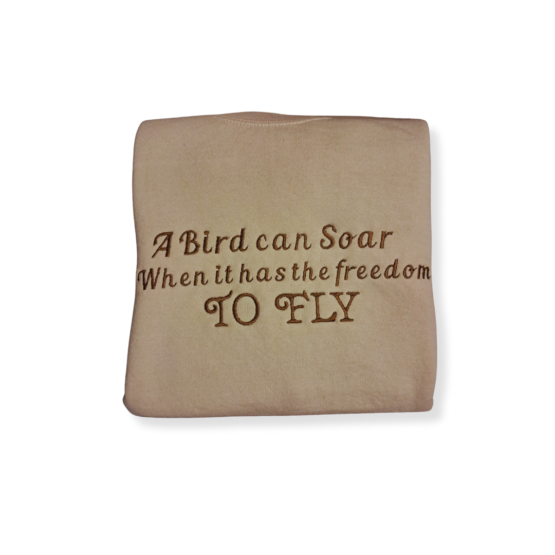 Embroidered "A Bird Can Soar" Crew Neck (Tan)